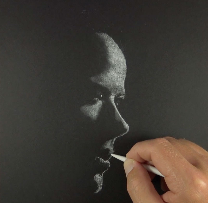 Blending white charcoal with a blending stump